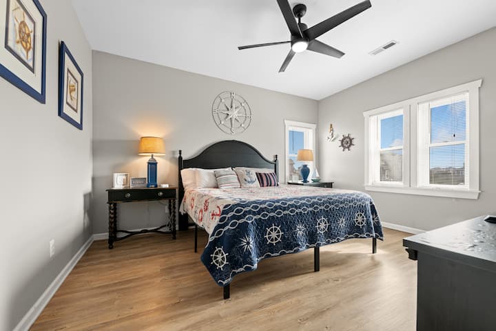 Mid-level king bed ensuite bedroom on the Second floor.  The Anchor Room is located in the Southeast corner of the house with views to the rear of the house and a peekaboo view of the ocean through the houses.  