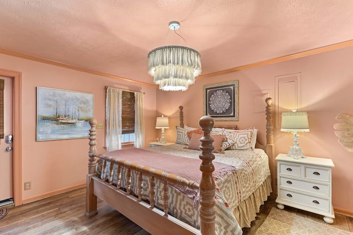 Recharge in this inviting king bedroom, where plush bedding, soft coastal décor, and a peaceful atmosphere create the perfect place to unwind after a day exploring Tybee Island.