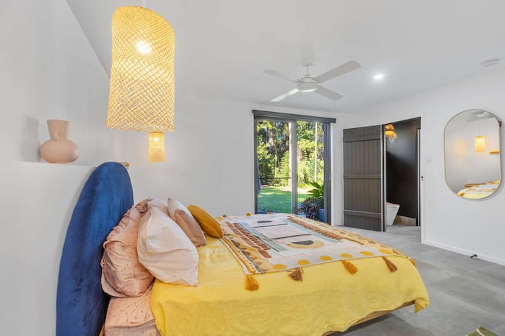 Spacious master bedroom with a plush king bed and calming interiors