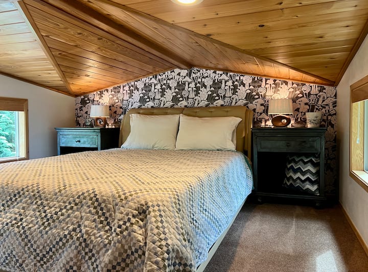 Loft bedroom retreat with warm lighting and custom details