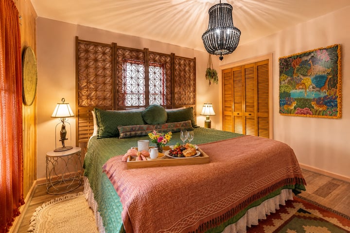 Wake up slowly with breakfast in bed in this inviting king suite, where warm wood accents, cozy lighting, and thoughtful touches create the perfect place to relax and recharge.