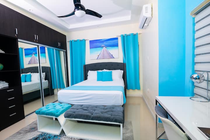 Dive into our Ocean Suite queen bedroom.