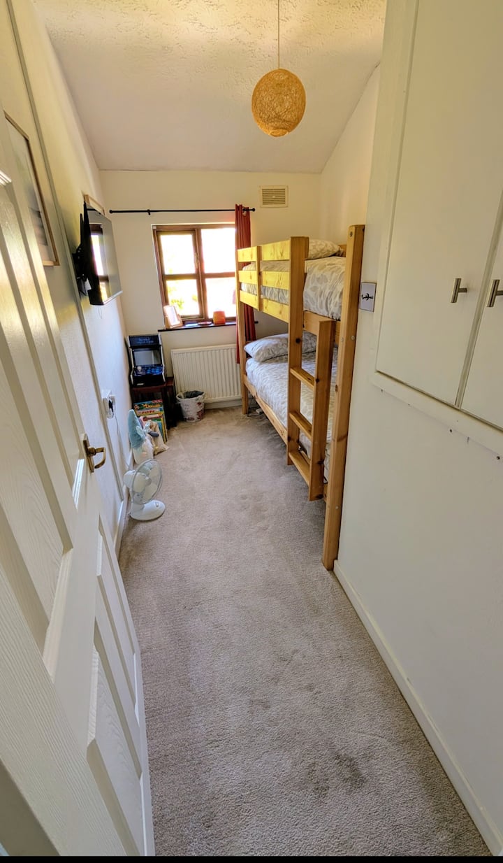 We have chosen a bunk with a lower height so that younger children can use top bunk. Bunk is solid pine and can take the weight of two adults!