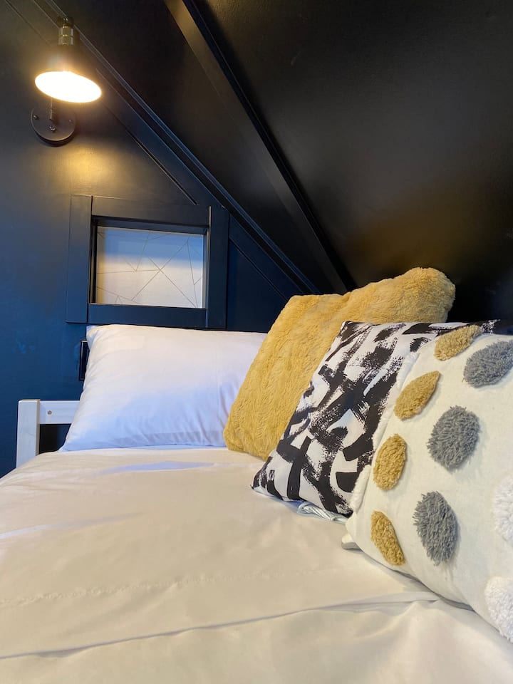 The cozy day beds are equipped with reading lamps and shelves equipped with usb charging docks. 