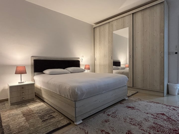 Master bedroom (King bed) with private bathroom, automatic rolling shutter windows and Balcony wide garden view