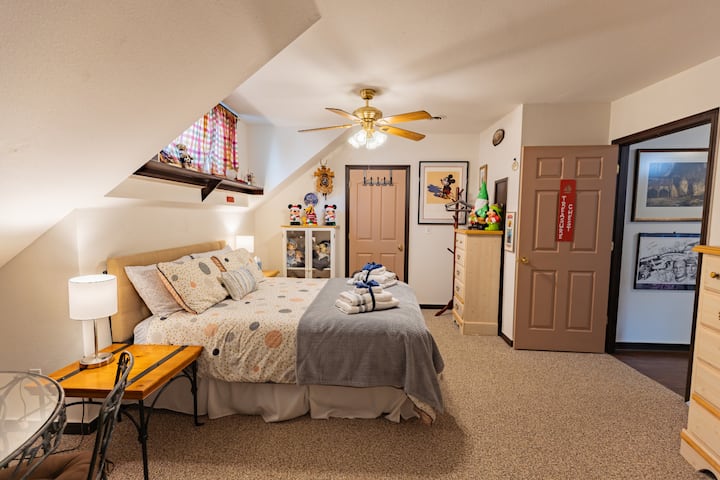 Spacious bedroom decorated with you in mind