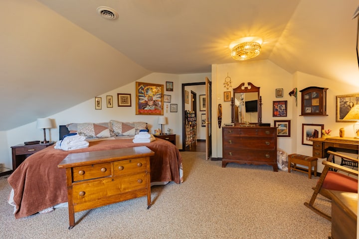 Master bedroom with stunning artwork and plenty of storage for clothes