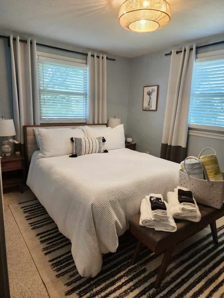 Sleep number mattress, down comforter . Extra pillows blankets and sheets if needed.Blackout drapes and blinds. Television with direct TV service. Lamps with USB charging stations.Ceiling fan wih remote control.