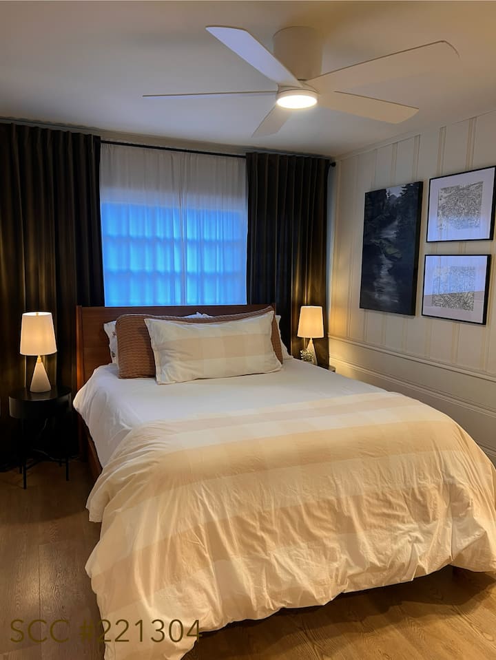 Sink into a plush queen bed and wake up refreshed in this tranquil retreat. The attached full bathroom provides privacy and convenience, while soft linens and warm accents make this the perfect place to unwind.