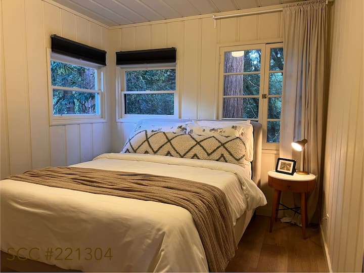 Enjoy a peaceful night’s sleep in this cozy queen bedroom, where the window overlooks the year-round creek. Fall asleep to the gentle sounds of flowing water and wake up feeling refreshed and connected to nature.