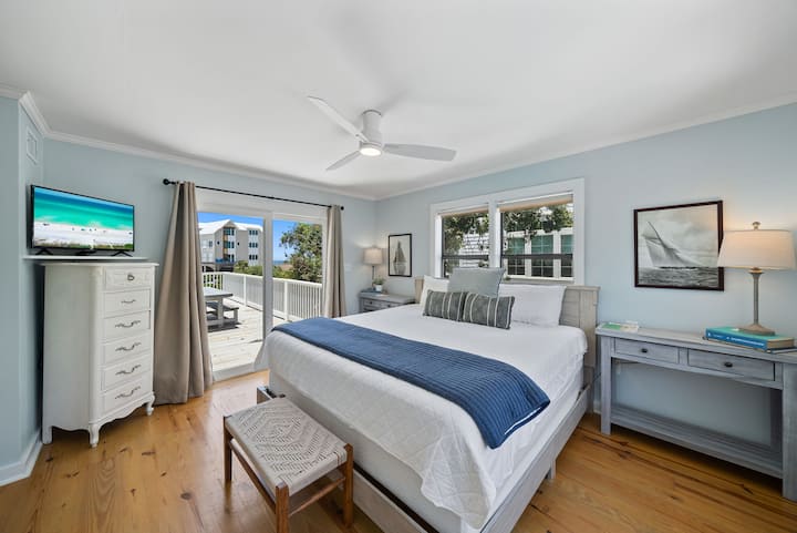 Rest easy in the light-filled primary bedroom with a king-sized bed — your sanctuary after sand and surf.