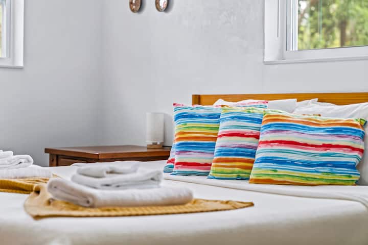 A closer look at the queen bedroom's fresh linens and neatly folded towels, the small staging details that back up guests calling this place spotless in review after review.
