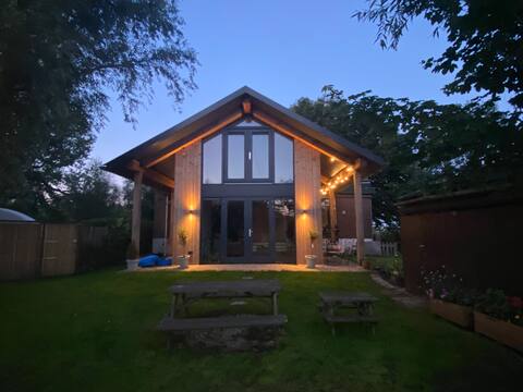 Renovated detached house next to swimming pool.
