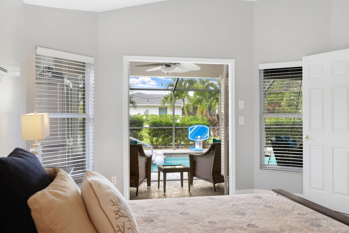 Relax in this spacious owner’s suite featuring a plush king bed, smart TV, and elegant coastal décor. Enjoy direct access to the patio and pool area, plus a private ensuite bath for ultimate comfort and convenience.
