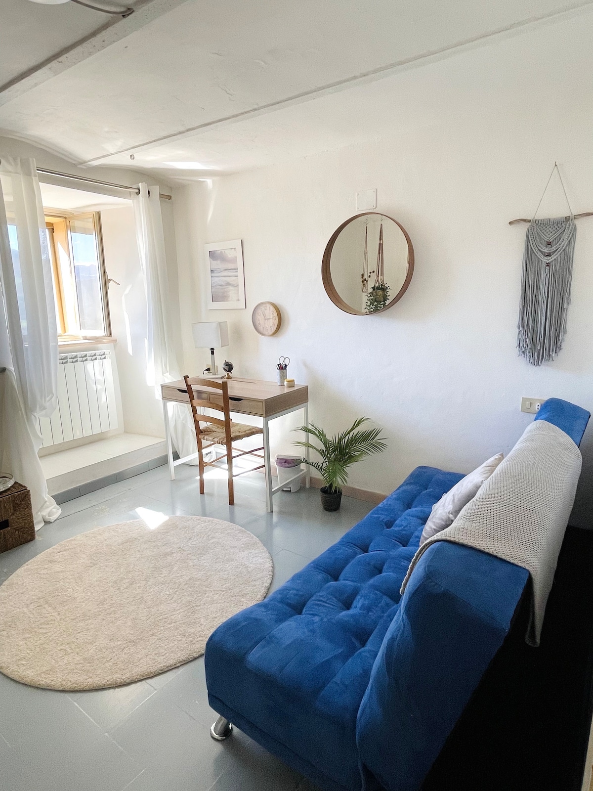 This lovely office space converts to a double bed sleeping area with a view and a cozy reading area.