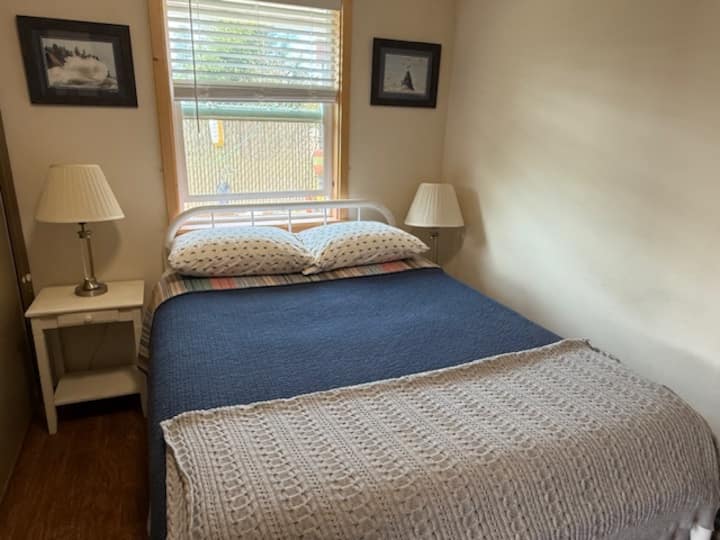 Full sized bed in the bedroom
