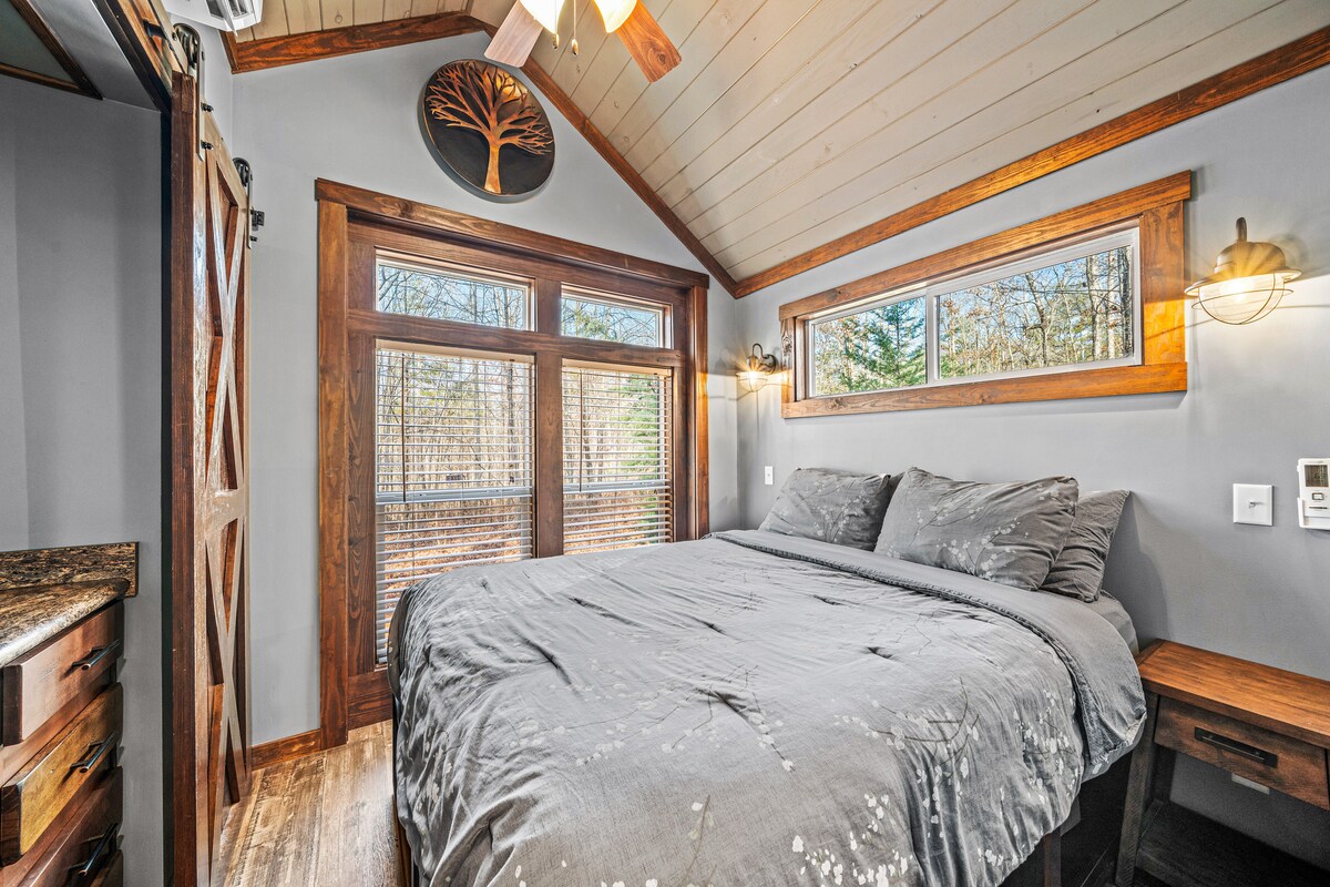 Bedroom 1 features a comfortable queen bed for a restful night’s sleep.