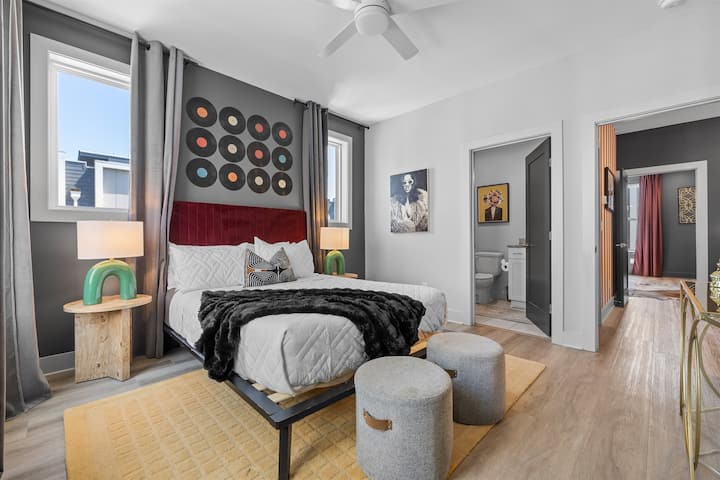 Bedroom Retreat: Retro vibes with vinyl decor and comfy furnishings for a perfect Nashville stay!
