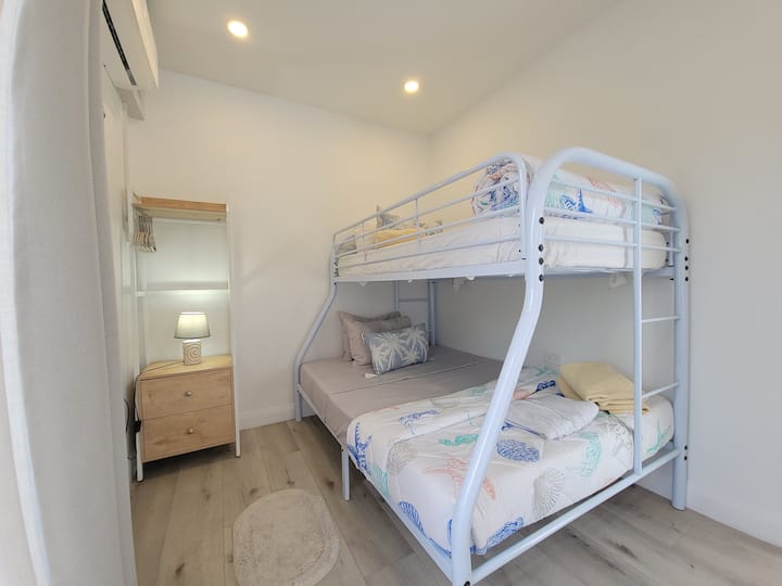 Bunk bed with 1 double bed at the bottom and sinlge bed at the top