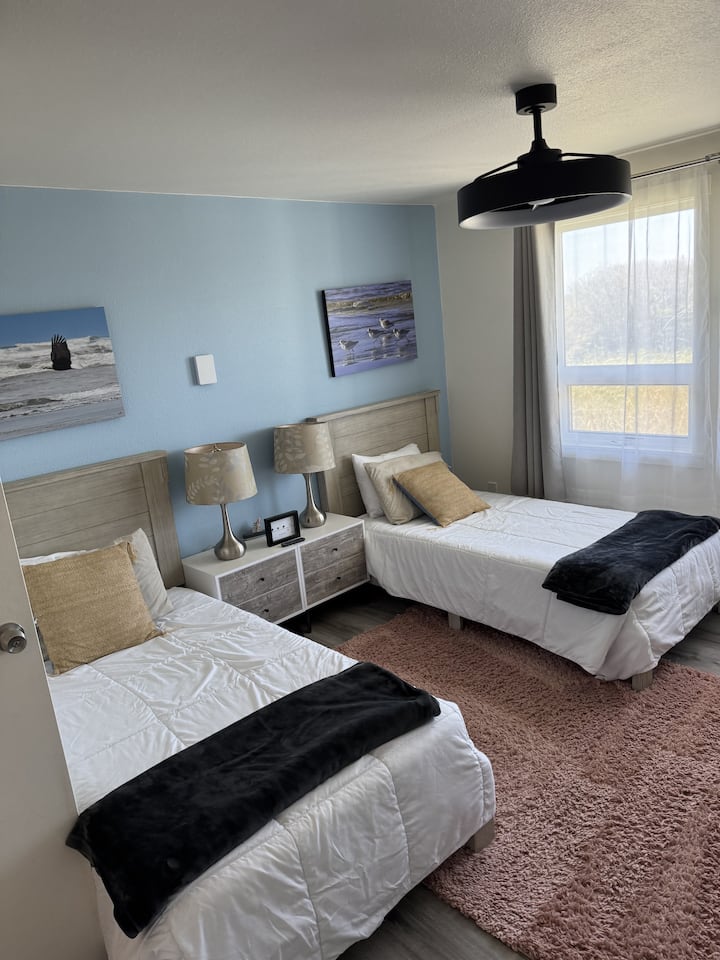 Bedroom with two twin beds.