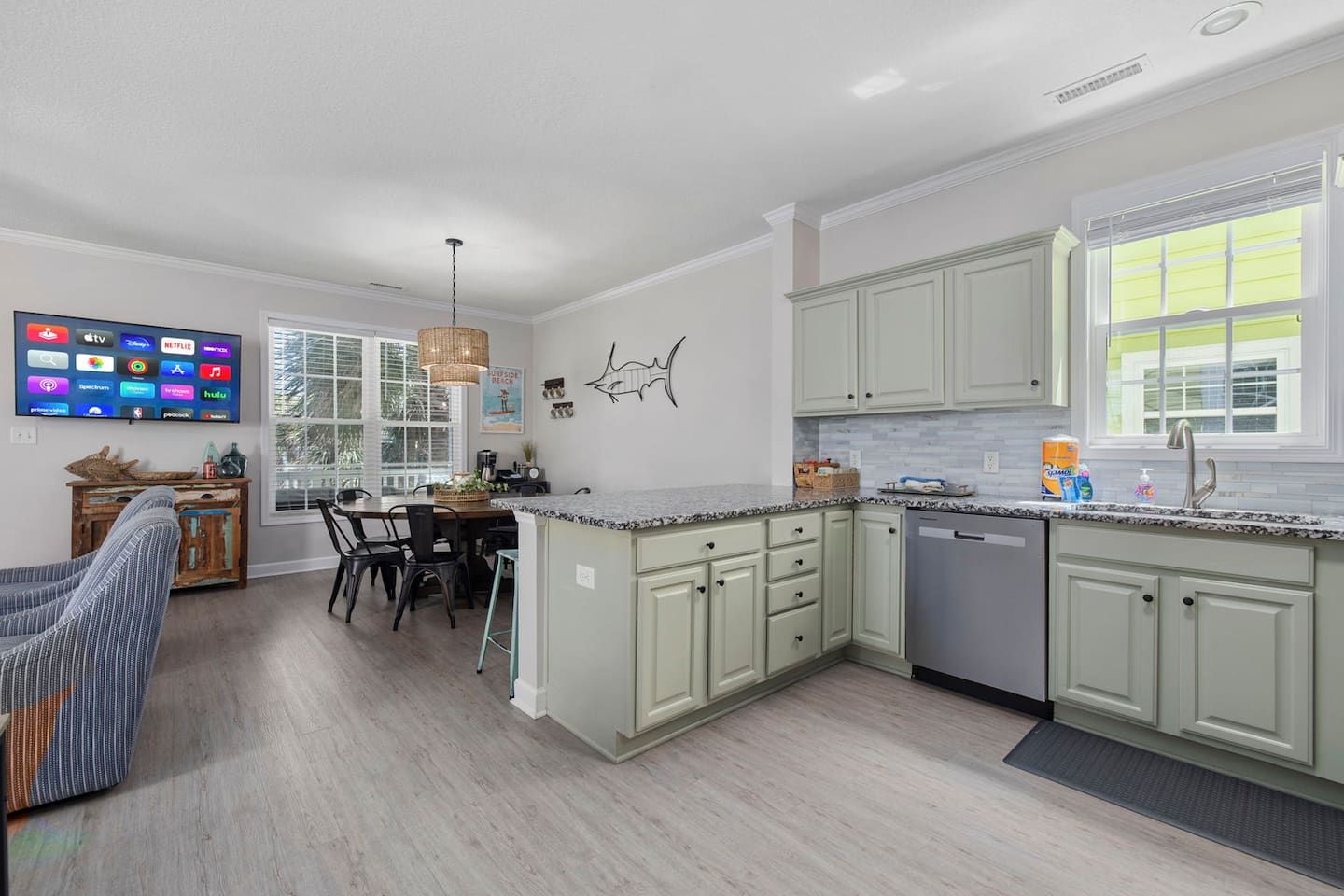 Cook at the granite countertops and see everyone at the dining table in the same glance. Open-plan living means the chef is never stuck alone in the kitchen.