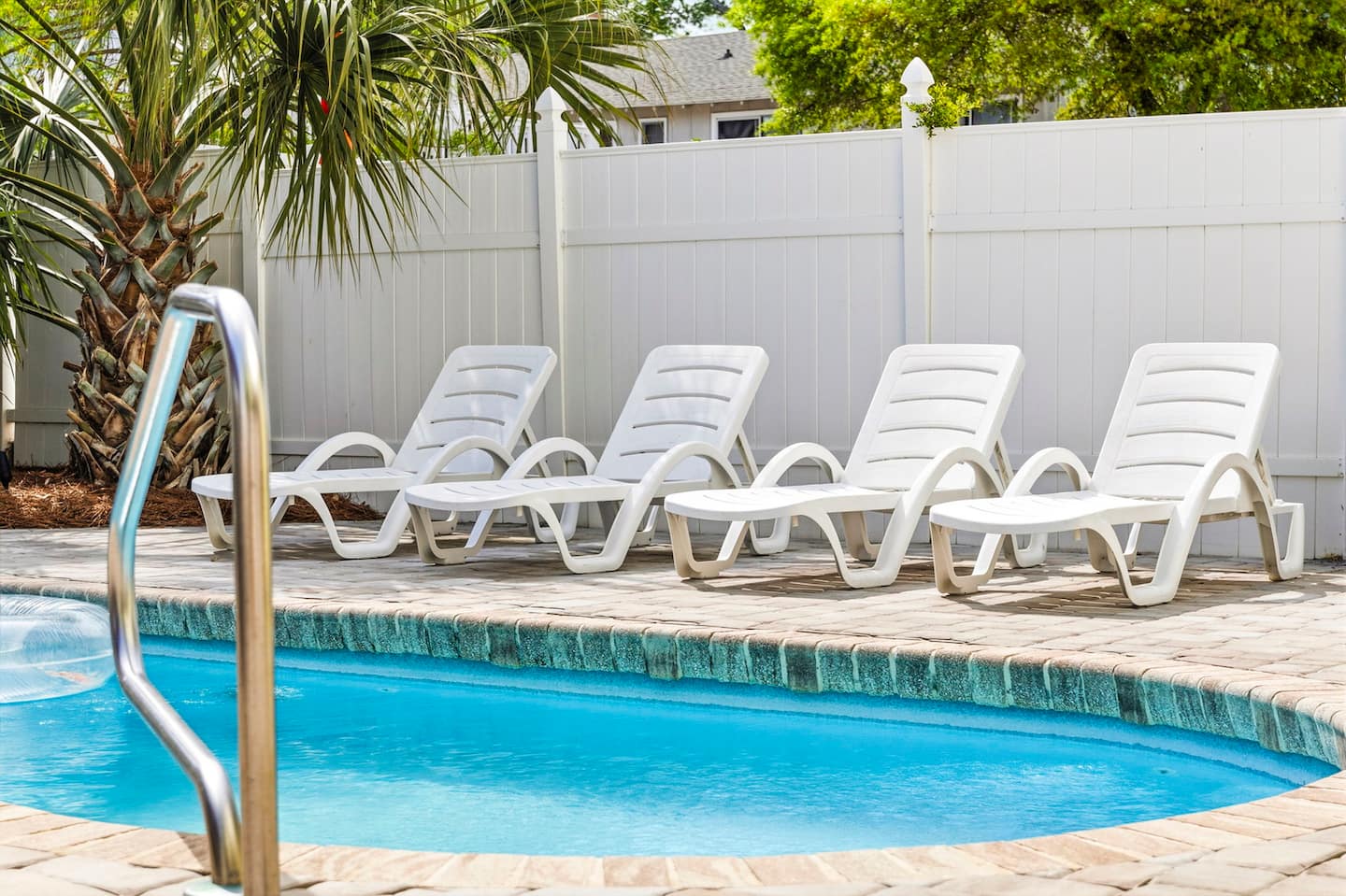 Wade in from the entry steps. The saltwater pool is five feet deep, crystal clear, and completely yours for the entire stay.