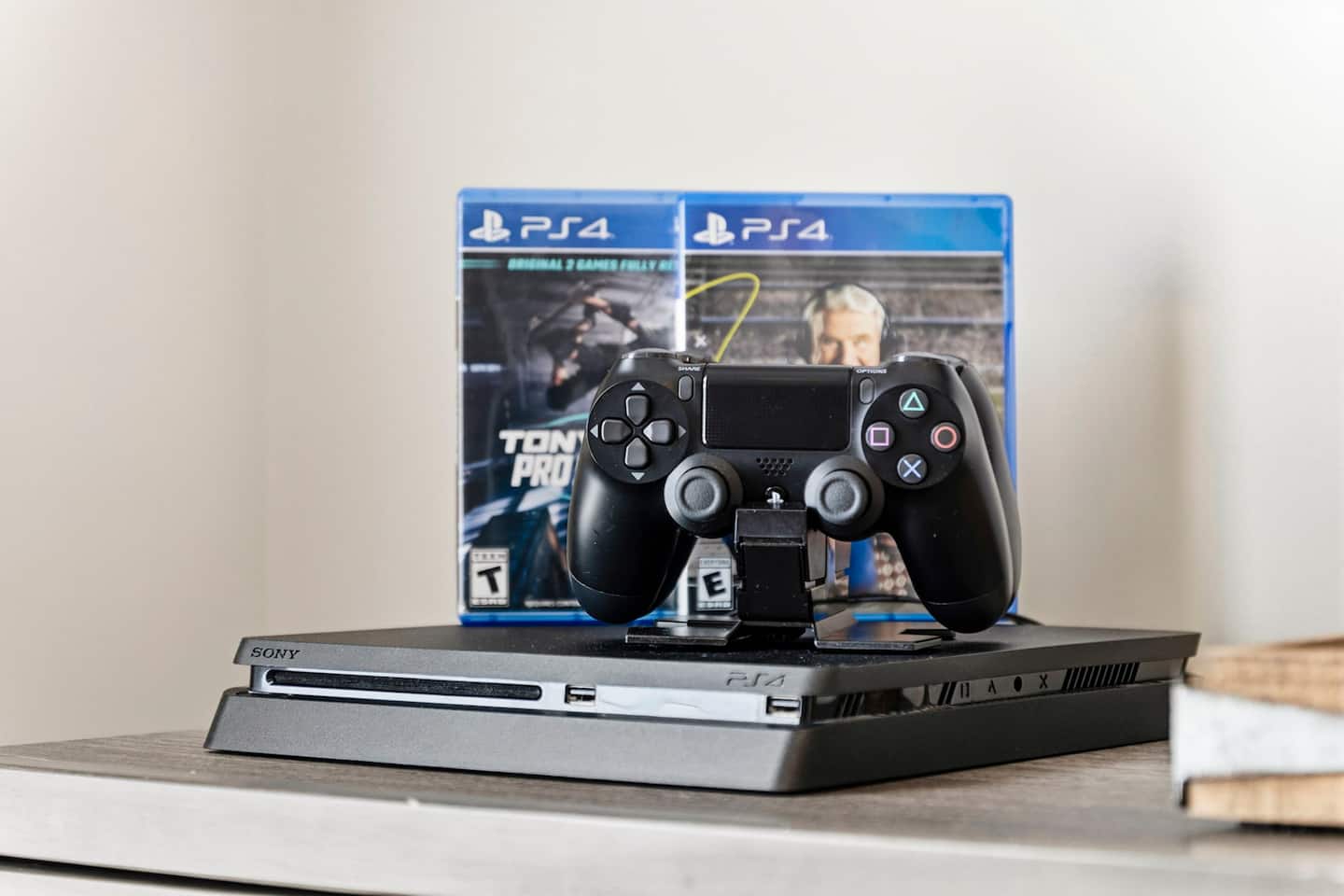 Check out the PS4 kit on the dresser. Two DualShock controllers and multiple game cases ready to go, no sharing with the adults downstairs.