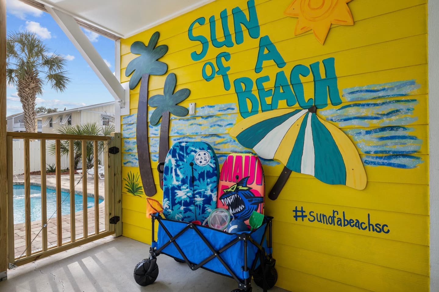 Find the SUN of A BEACH mural before you even unpack. Your first vacation photo is painted right on the exterior wall, hashtag and all.