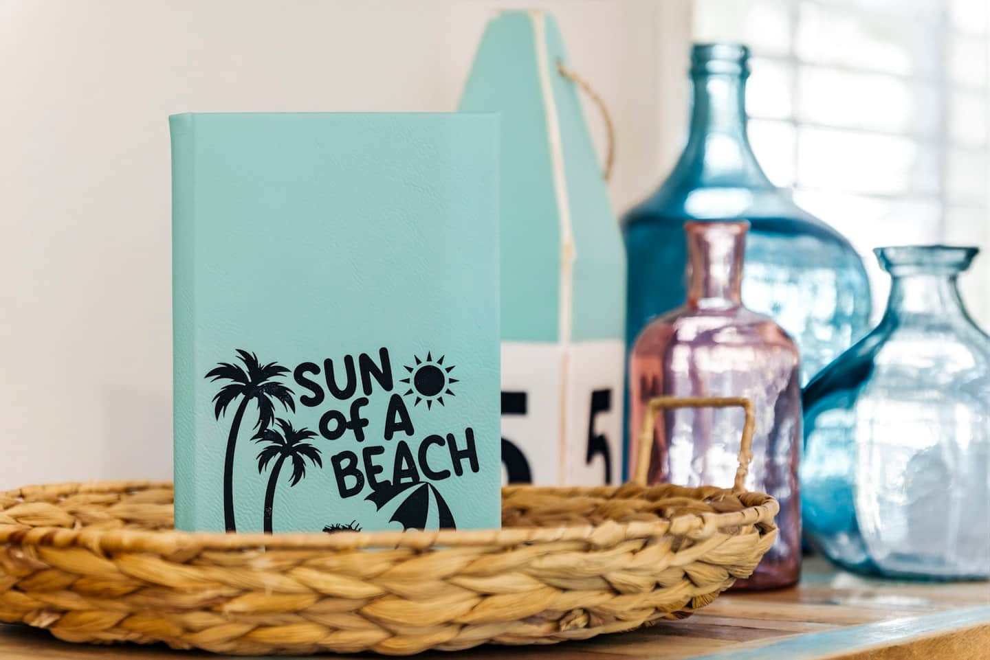 Don't forget to sign the guest book in the wicker tray before you leave. It is curated and waiting alongside the coastal decor.