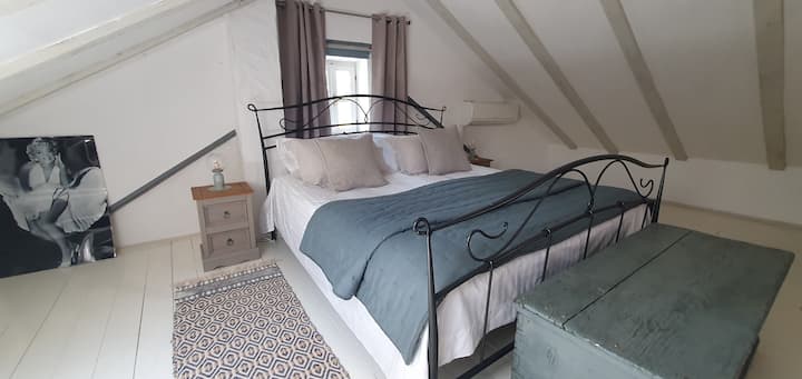Bedroom one with king bed