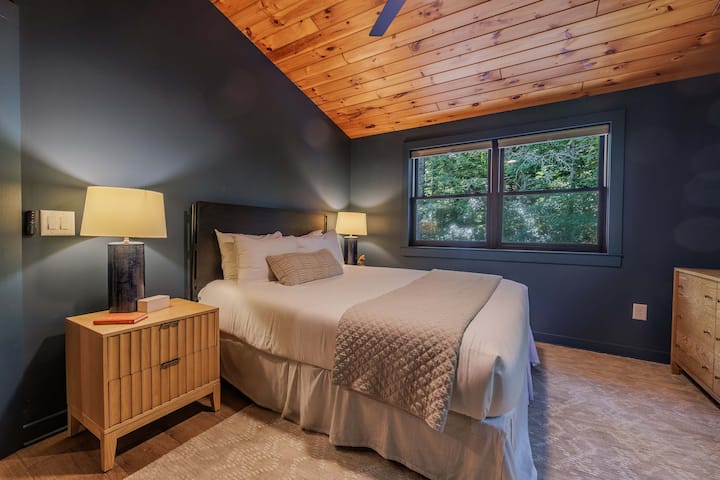 A cozy West Elm queen bedroom on the upper level, each with its own character and comfort designed for a restful mountain stay.