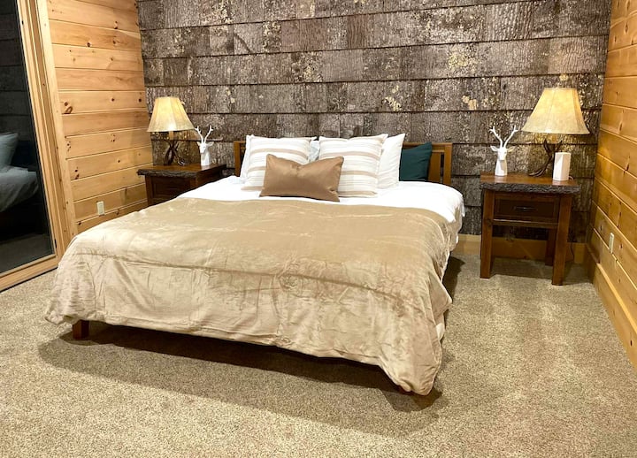 Master bedroom ensuite, downstairs. King size bed.