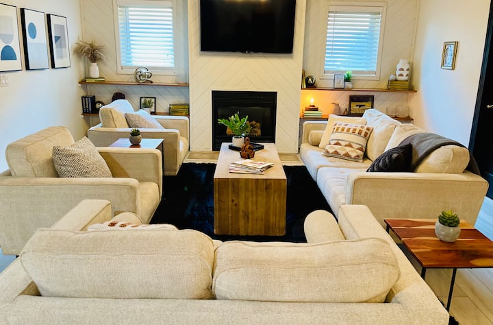 Relax and unwind in the lower level living room space.  Plenty of comfortable seating here to watch movies, play games, and socialize.  