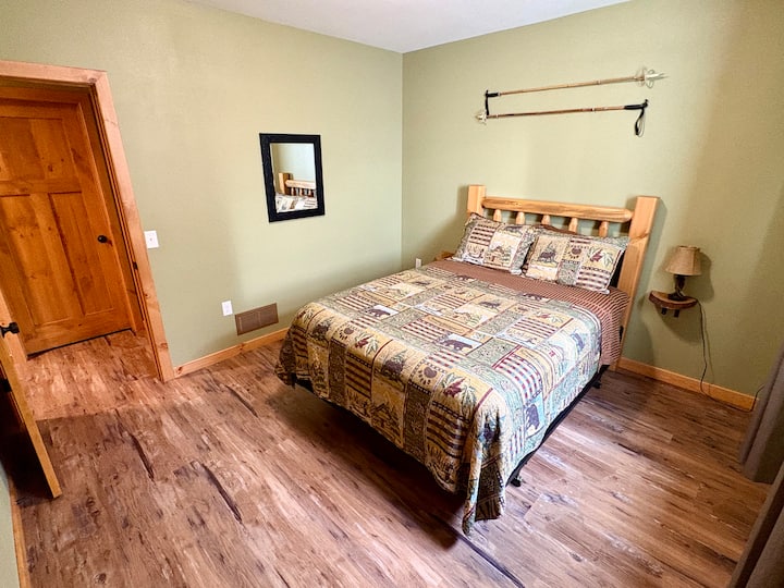 Lower-level bedroom with queen bed.