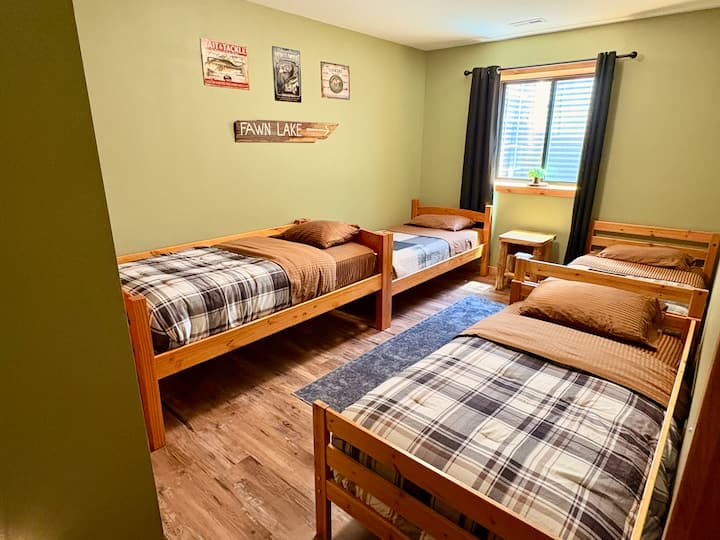 4 twin beds in lower level bedroom.