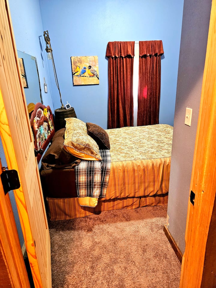 New carpet, queen size bed with medium mattress on top of box spring.