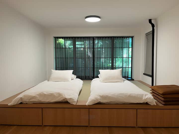 Two Futon mattresses on tatami.