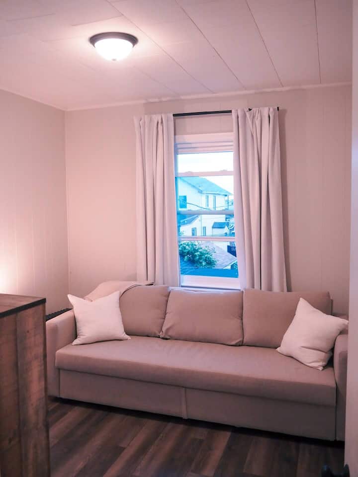 This is a pull out couch and opens up to a full bed. It is very comfortable and sleeps 2 guests.