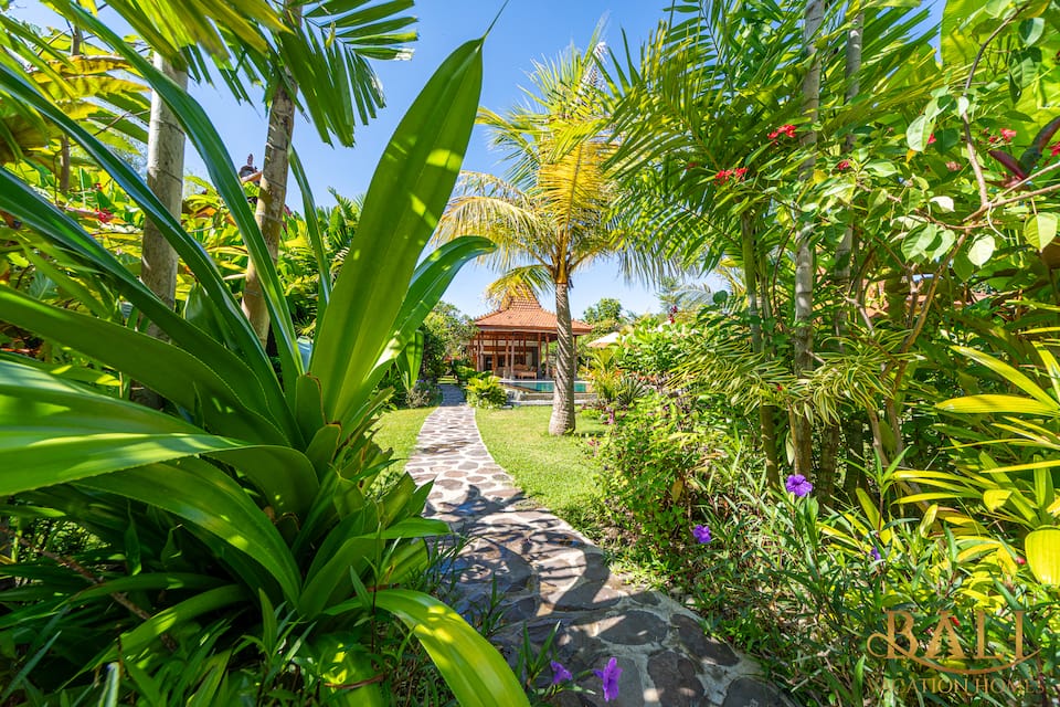 Two joglo pavilions in a big tropical garden on Bali's north coast, Seririt, Buleleng, Bali, Indonesia, photo 1 of 10