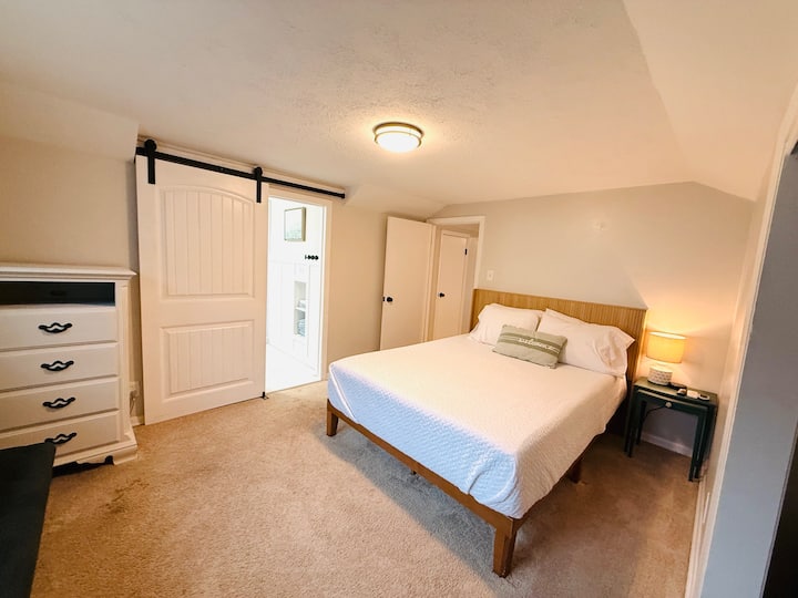 Second Floor Queen Bedroom with brand new ensuite bathroom with walk in shower. Come and relax. The room also has a window unit that provides addt'l heat and a/c.