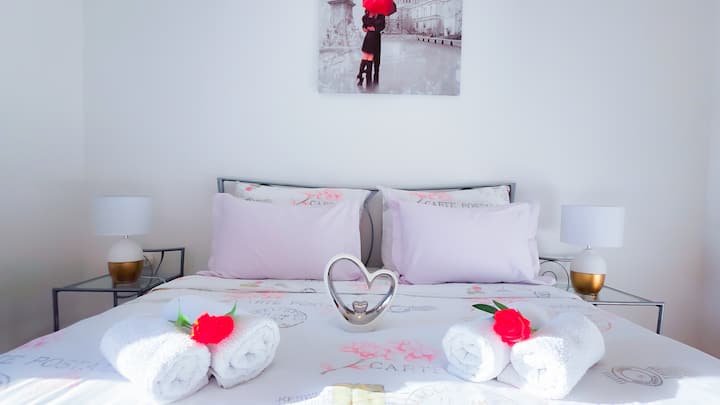 Bright bedroom with a double bed, wardrobe storage and a window for natural light. A comfortable sleeping space for two guests, ideal for couples or parents staying with family.