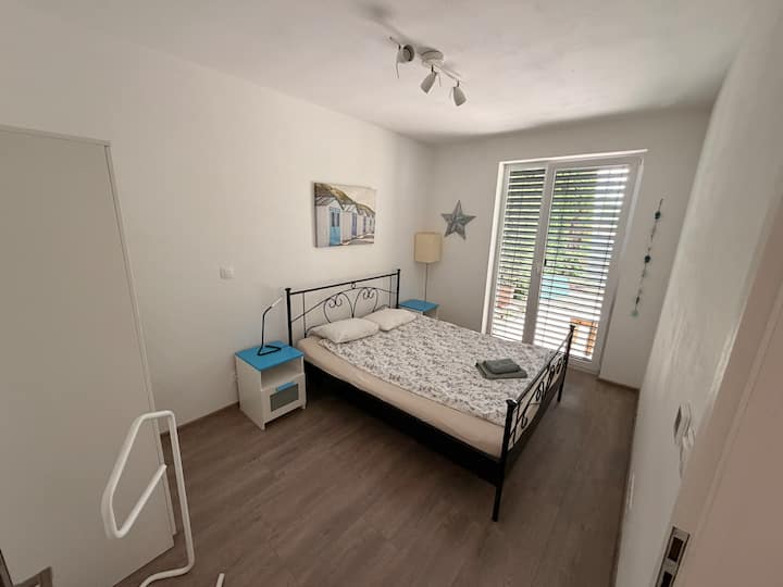 Master bedroom, lake facing with door to garden
