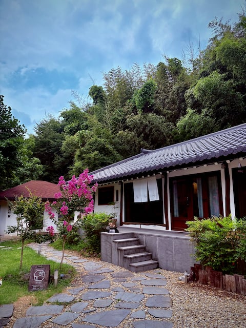 A private hanok stay that fits the small landscape.