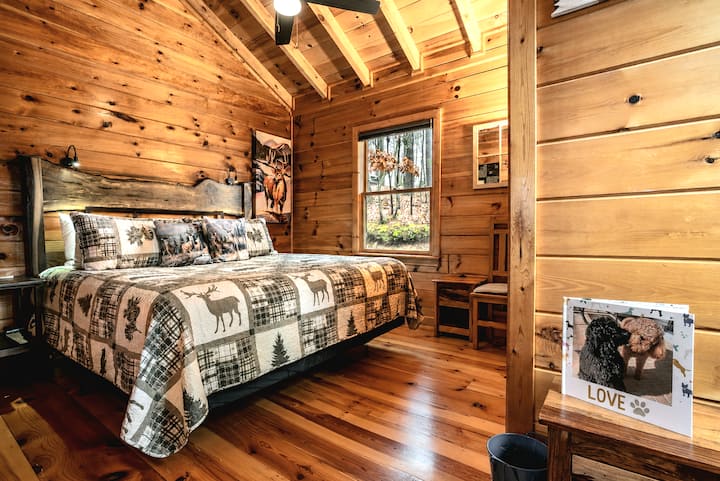 Deer and bear themed King bedroom. 
Sum Fun: A Log Cabin. Blue Ridge Mountain views, dog friendly with fully fenced yard, hot tub, fire pit, 2 decks, wood burning fireplace, game room: Foosball, dart board, life-sized games, & more