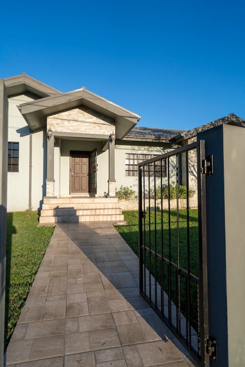 Modern home with fenced in yard