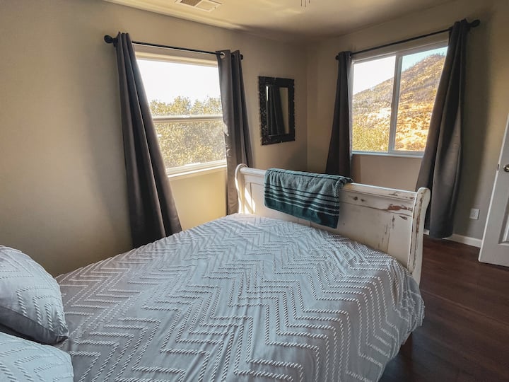 Newly added blackout curtains! 
Private upstairs bedroom with a queen bed with loft and private bathroom.
Enjoy waking up to these amazing views of the property and Buckingham mountain. 