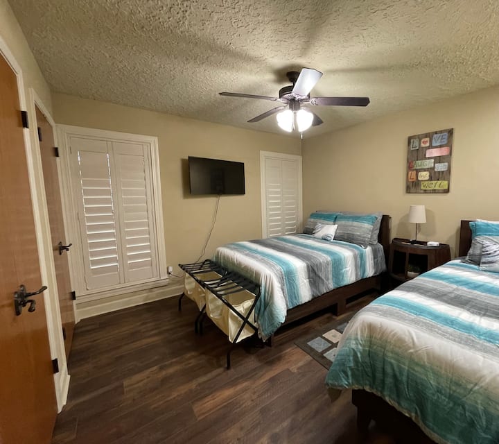Second bedroom has a full size bed and a twin bed + a TV.  
There is a dresser and an iron & ironing board in the first closet and plenty of extra blankets and pillows in the second closet.