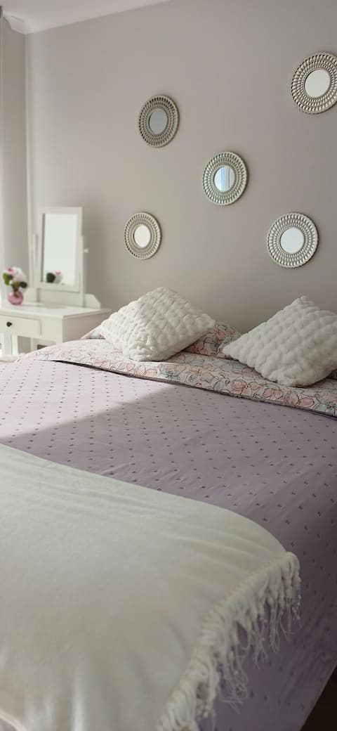 Centrally located apartment with private parking.