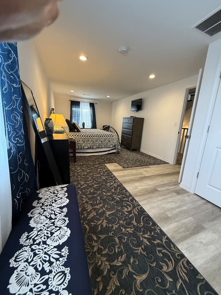 The Blue Room!  Second floor  King Suite with attached full bathroom.  Suite includes a private seating area, SmartTV, and large closet.  Extra linens, full length mirror and lots of space! 