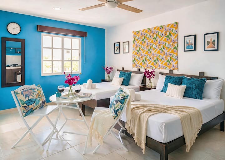 Sink into crisp linens after a day of adventure. The inviting queen bed promises restful nights, while the additional double bed offers flexibility for extra guests, friends, or family without compromising comfort or space.